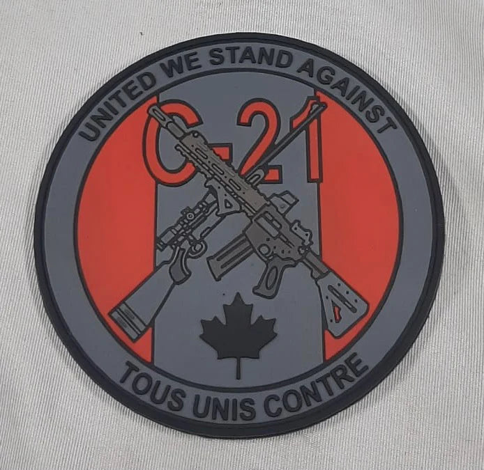 ÉCUSSON TOUS UNIS CONTRE C-21